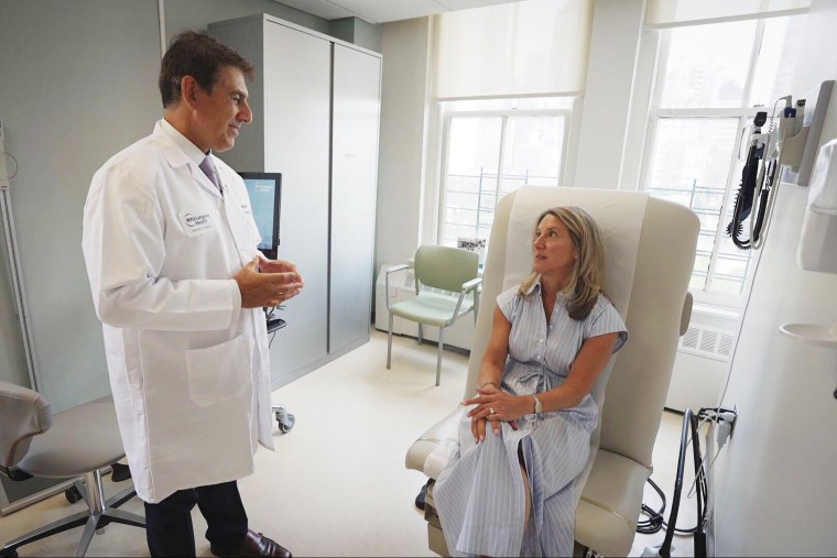 Katie Mohan talks with her doctor.