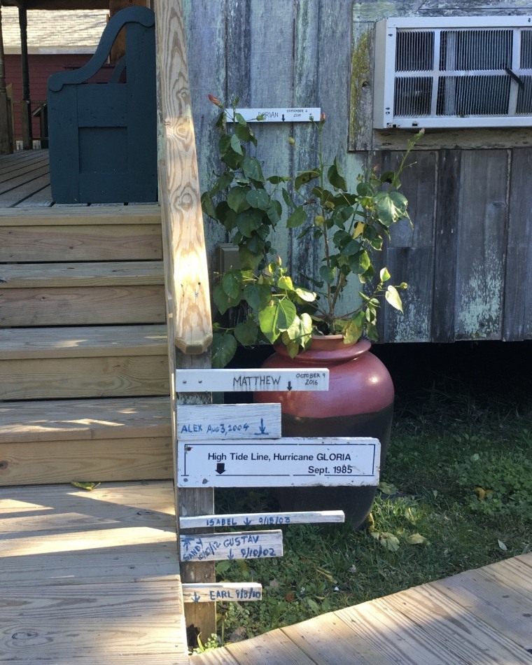 Water markers on a home, seen on the steps outside