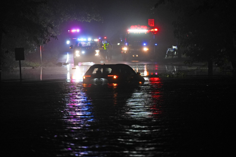 A car sits in floodwaters in Plainfield, N.J.