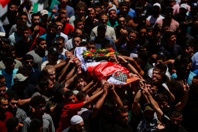 Mourners take part in the funeral of of Sayfollah Kamel Musallet, killed amid the Israel-Gaza conflict, near Ramallah