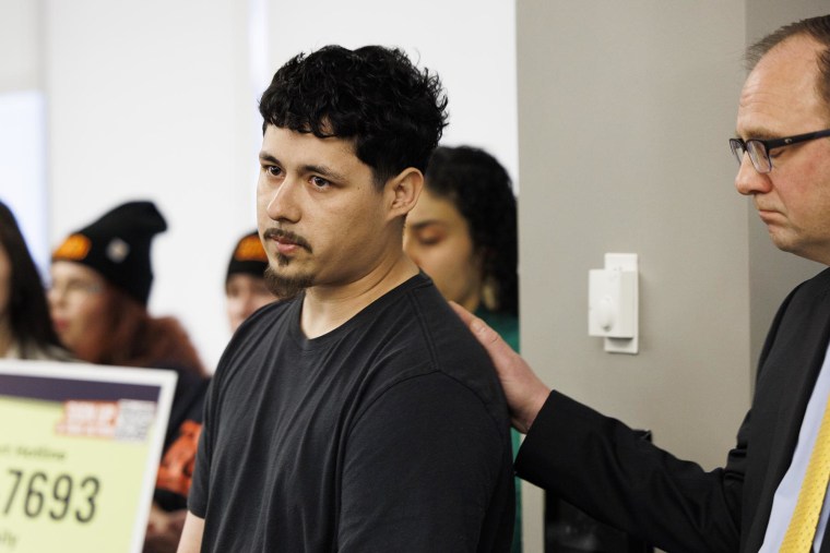 Eduardo Orozco discusses the arrest of his father, Abel Orozco, while being comforted by attorney Mark Fleming at the National Immigrant Justice Center on March 17, 2025, in Chicago.