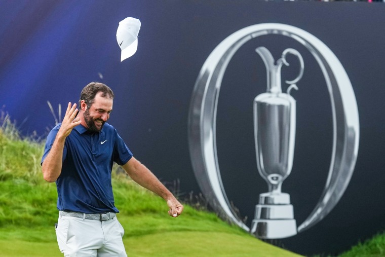 Scottie Scheffler celebrates outside while walking