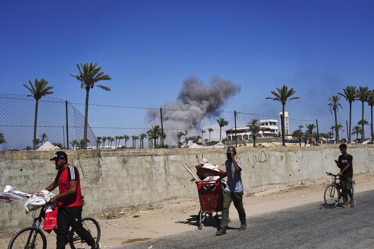 Palestinians flee Deir al-Balah in central Gaza on Sunday, July 20, 2025, after the Israeli military issued evacuation orders ahead of expected operations in the area.