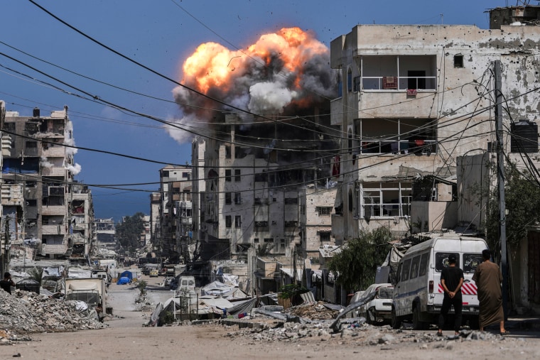 Smoke and flames erupt from an Israeli airstrike connected a building