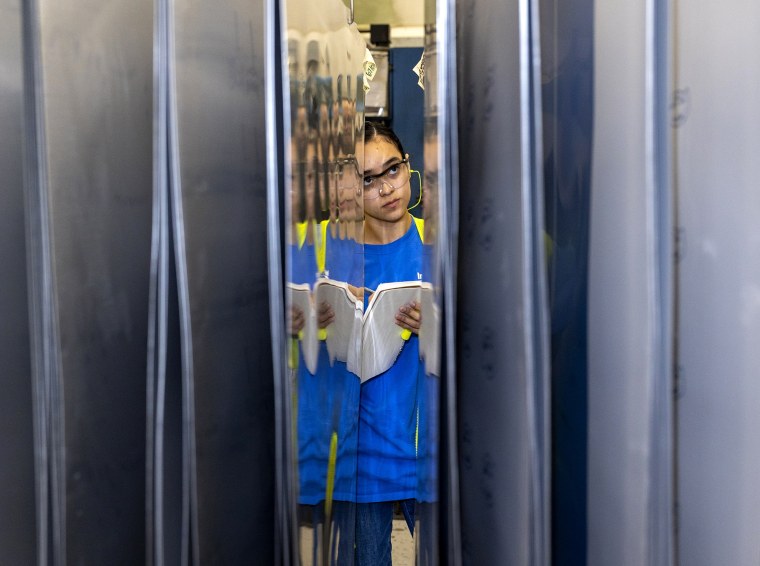 Vanessa Sanchez inspects printing plates on Friday, July 18, 2025 in Belcamp, MD at Independent Can Company.
