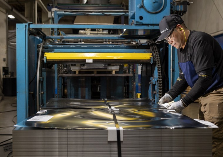 Juan Guzman runs a printing press on Friday, July 18, 2025 in Belcamp, MD at Independent Can Company.