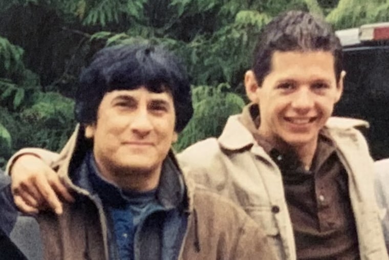 Daniel Savala poses with Eli Stewart during a trip with other young followers in Alaska in 2002.