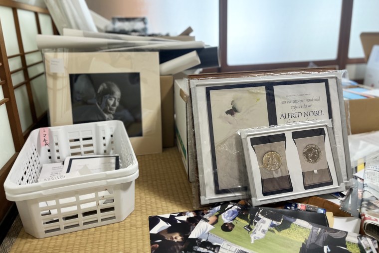 Framed copies of the Nobel Peace Prize certificate and medals at Mimaki’s home outside Hiroshima.
