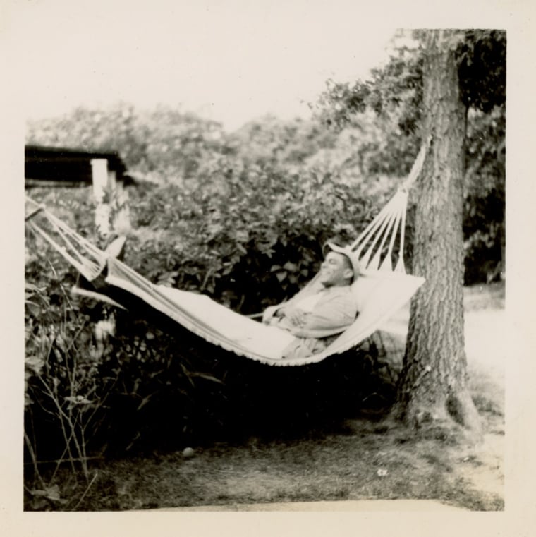 Man successful casual apparel and shot headdress relaxing successful a hammock