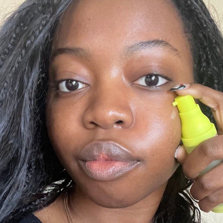 Woman applying NYX concealer on face