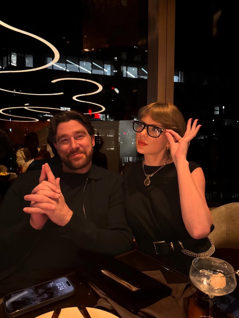 Travis Kelce shared a picture of himself and Taylor Swift dressed in black.