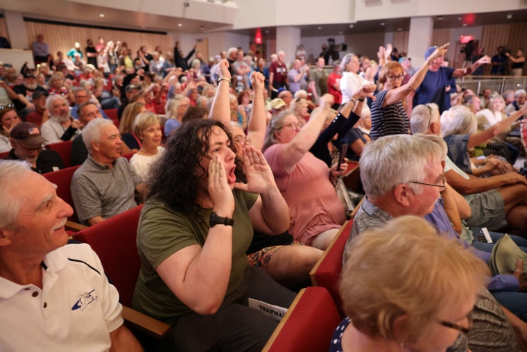 A Republican got jeered at a townhall. He plans to hold more. U.S. Representative Mike Flood (R-NE), answers questions from constituents during a town hall in Lincoln, Nebraska