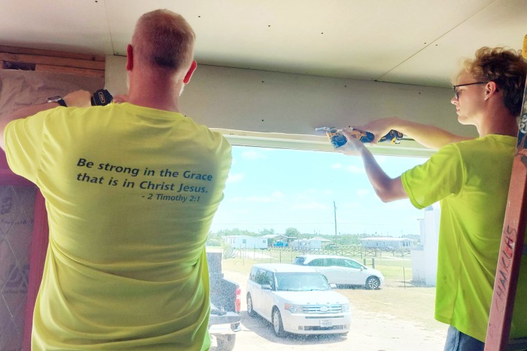 Church members help the boy fix his house.