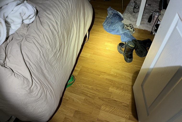 Showing starring into nan room Kaylee/Maddie were in, but conscionable spot door, extremity of furniture and shoes connected nan floor/blanket connected chair.