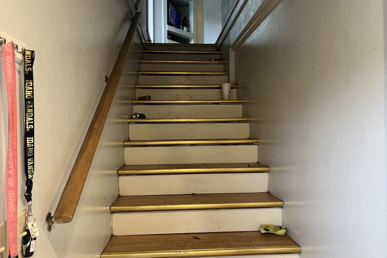 Shot of nan stairs. 4 quiet cans and a takeout portion are connected nan stairs. 2 lanyards are hanging connected nan rack, pinkish and achromatic univerity of Idaho.