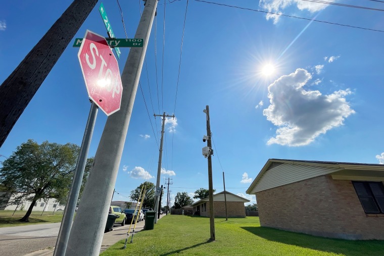 A surveillance camera affixed to a utility pole