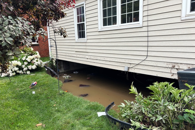 The collapsed foundation of Jean and Dave Krajewski's home in West Allis, Wisc., on Sunday.