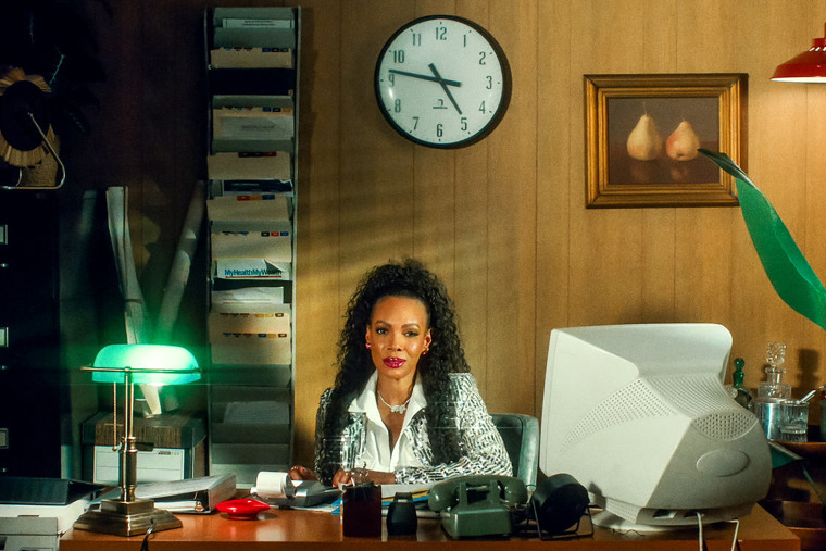 Past MC Dancer Gigi Maguire. at her desk.