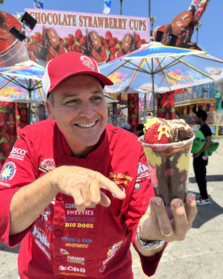 Dominic Palmieri points to a Dubai Chocolate Strawberry cup.