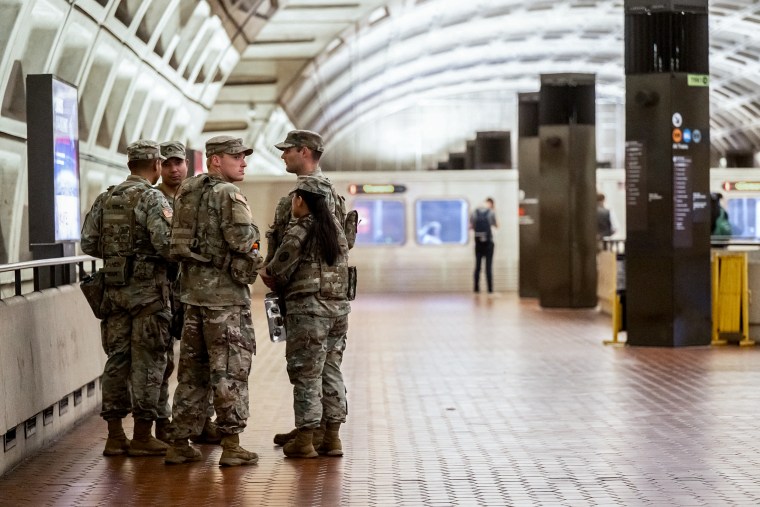Image: Members of the National Guard patrol inside the Metro Center Metrorail Station