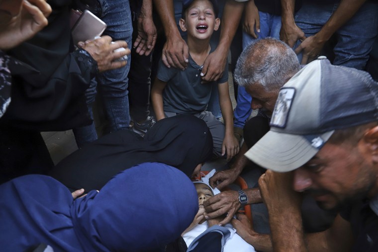Relatives mourn complete nan assemblage of 13-year-old Karim Qdeih, who was killed successful overnight Israeli strikes,