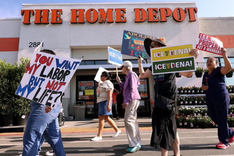 Anit-ICE activists march outside the Home Depot in Pasadena, Calif., on Aug. 6, 2025. 