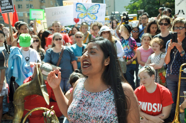 Catalina "Xochitl" Santiago speaks outside among protestors