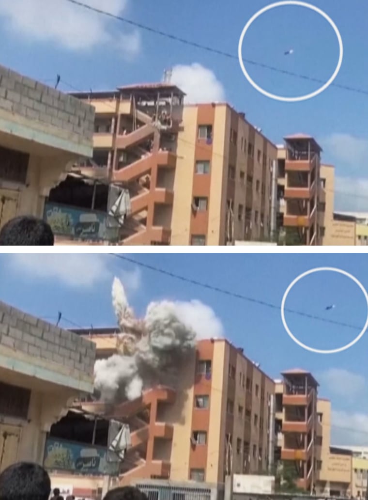 Two missiles are seen near and hitting Nasser Hospital on Monday.