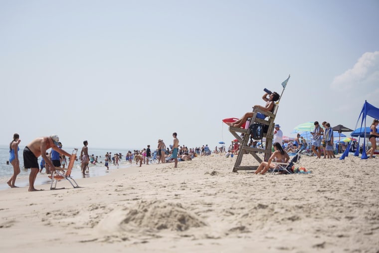 Beachgoers enjoy a summer day at Towers Beach, in Rehoboth Beach, Del., on July 30, 2025.