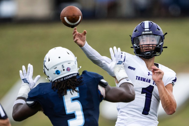 Dylan Hair throws a football