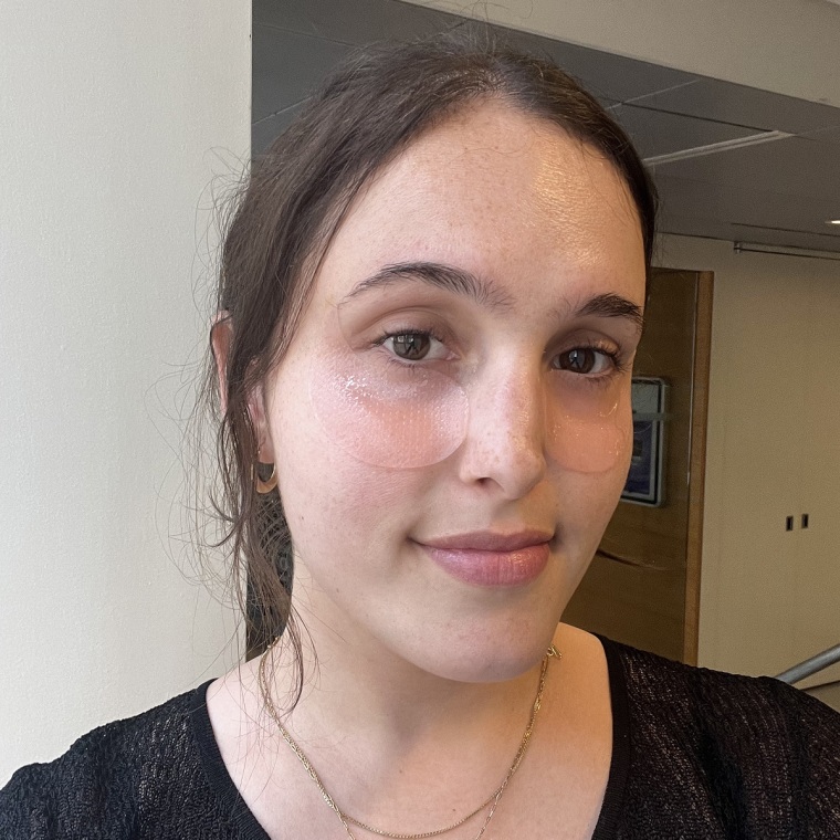 Woman wearing Abib patches under her eyes