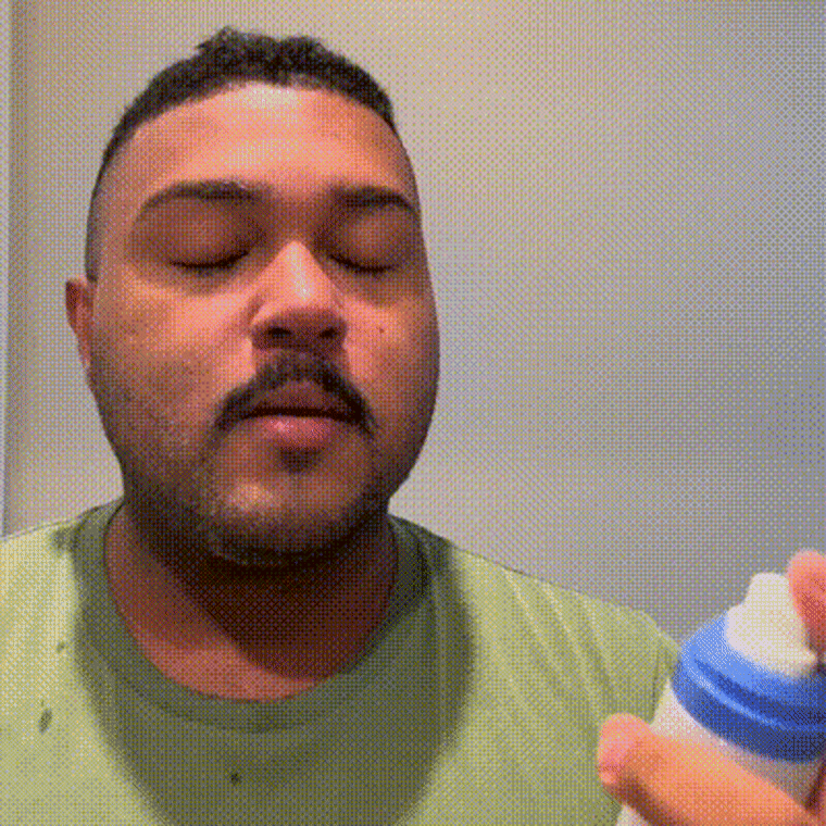 Gif of man spraying Aestura face mist on face