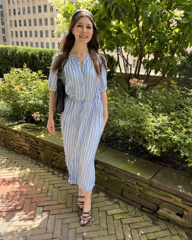 Senior Associate Victoria Herlocker wears the Amazon Essentials Half-Sleeve Midi A-Line Dress with Pockets.