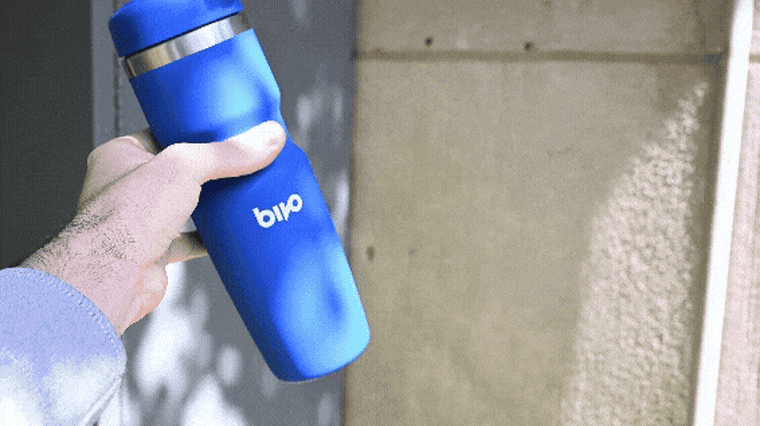 A video of NBC Select reporter Harry Rabinowitz tilting a Bivo cycling bottle upside down. Water flows out of the bottle in a controlled fashion.