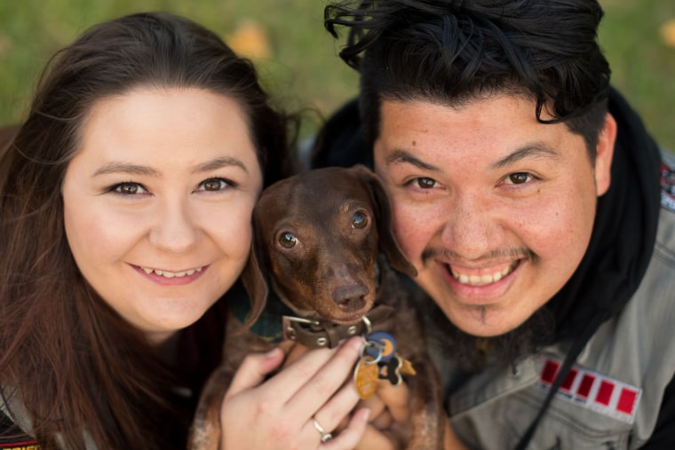 Liz and Sergio Barraza with their dog, Diesel