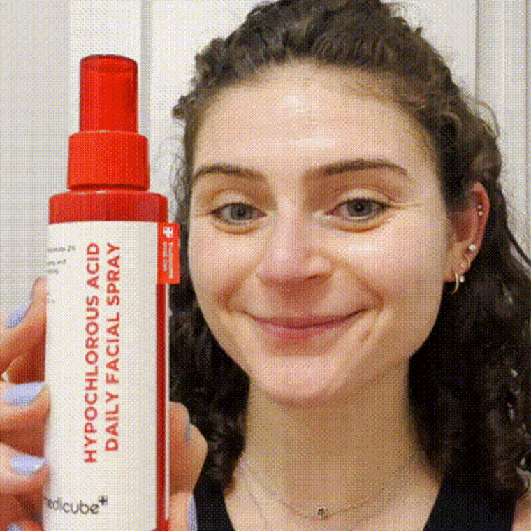 Gif of woman spraying Medicube facial mist on face