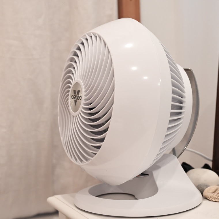 A close up of the Vornado 560 Air Circulator on top of a white dresser