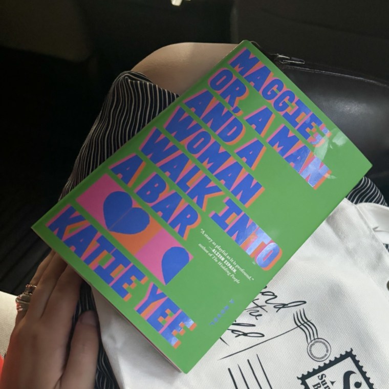 Maggie; or, A Man and a Woman Walk Into a Bar being read in a car.