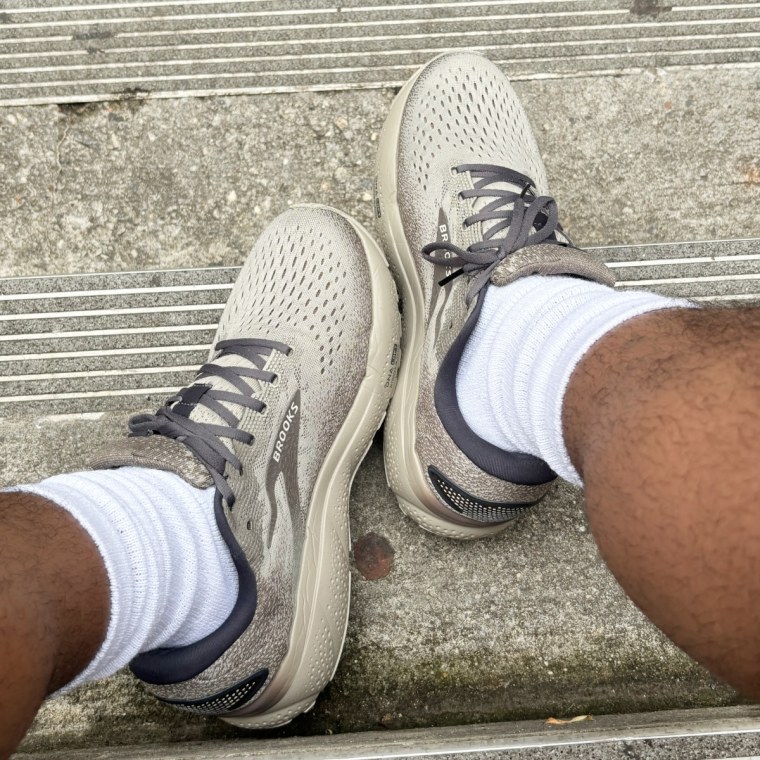 Man wearing the Brooks Ghost 16 Running Shoe on the sidewalk.