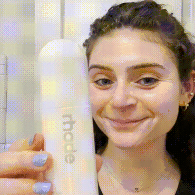 Gif of woman spraying Rhode facial mist on face