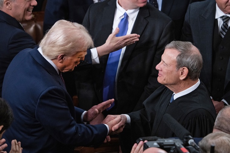 President Donald Trump greets Chief Justice John Roberts
