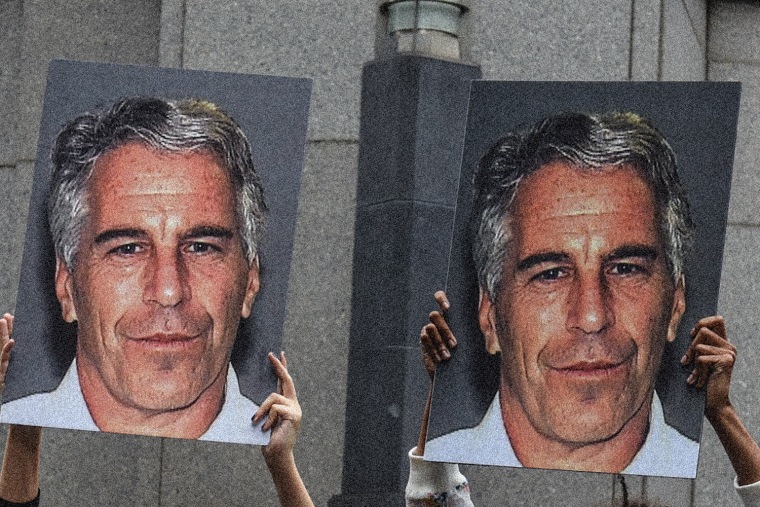 Protesters hold posters of Jeffrey Epstein
