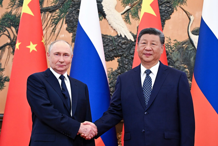 Xi, Putin hold talks in Beijing
