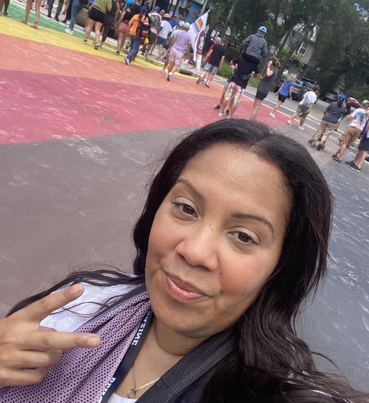 Tamara Leigh joins others Monday, Sept. 1, 2025, at the remaining mural in St. Petersburg, Fla.