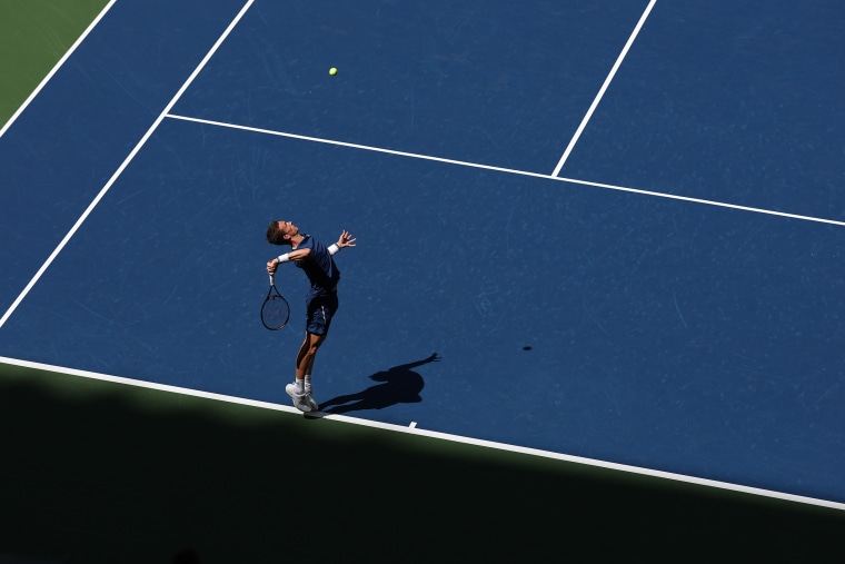 Jiri Lehecka of Czechia serves to Carlos Alcaraz of Spain during the Men's Quarterfinal match on Day Ten of the 2025 US Open.