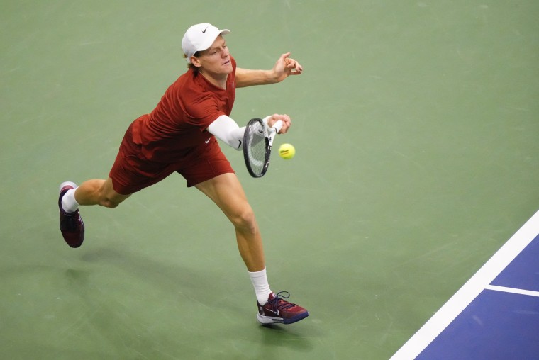 Image: Jannik Sinner returns a shot to Carlos Alcaraz during the men's singles final of the U.S. Open.
