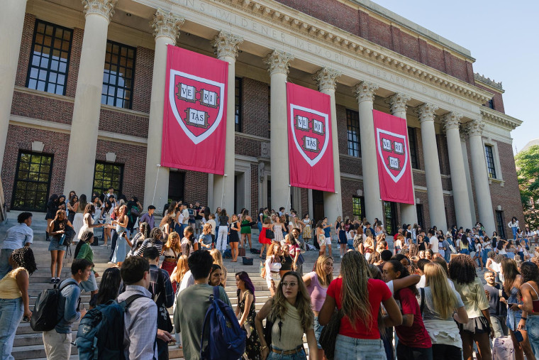Students gather in front of the Widener Library on the first day of classes at Harvard University.