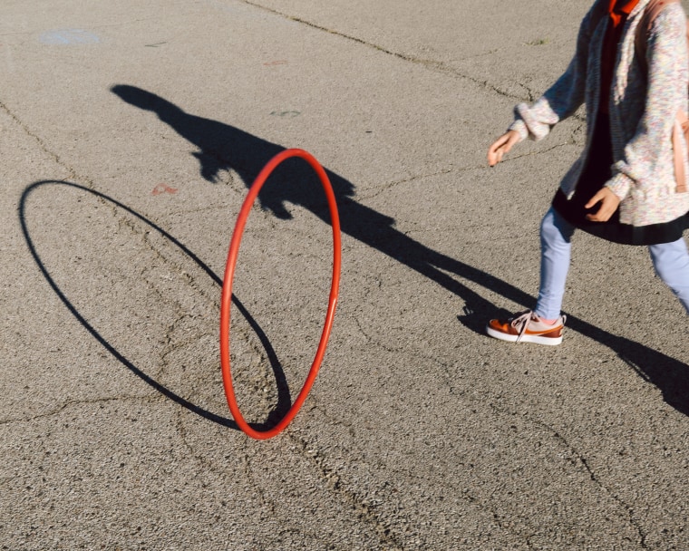Lucy Pratt plays with a hula hoop