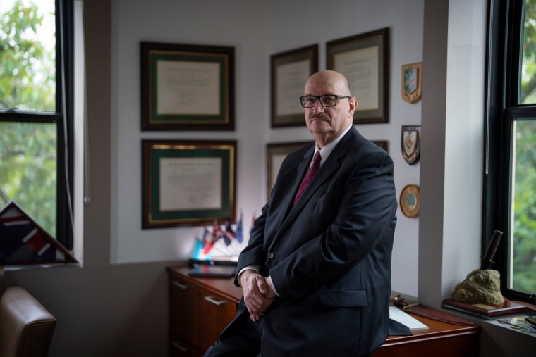 John Dinkleman sits in his office
