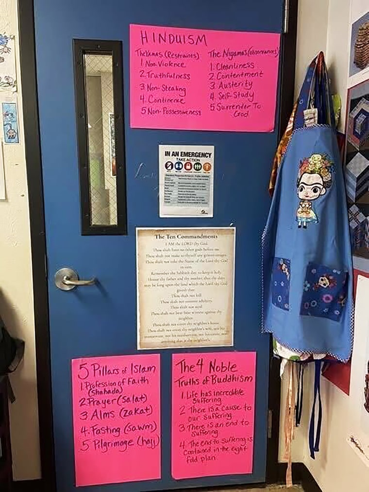 A suburban Dallas teacher has included posters about other religions on the door of her elementary school classroom.